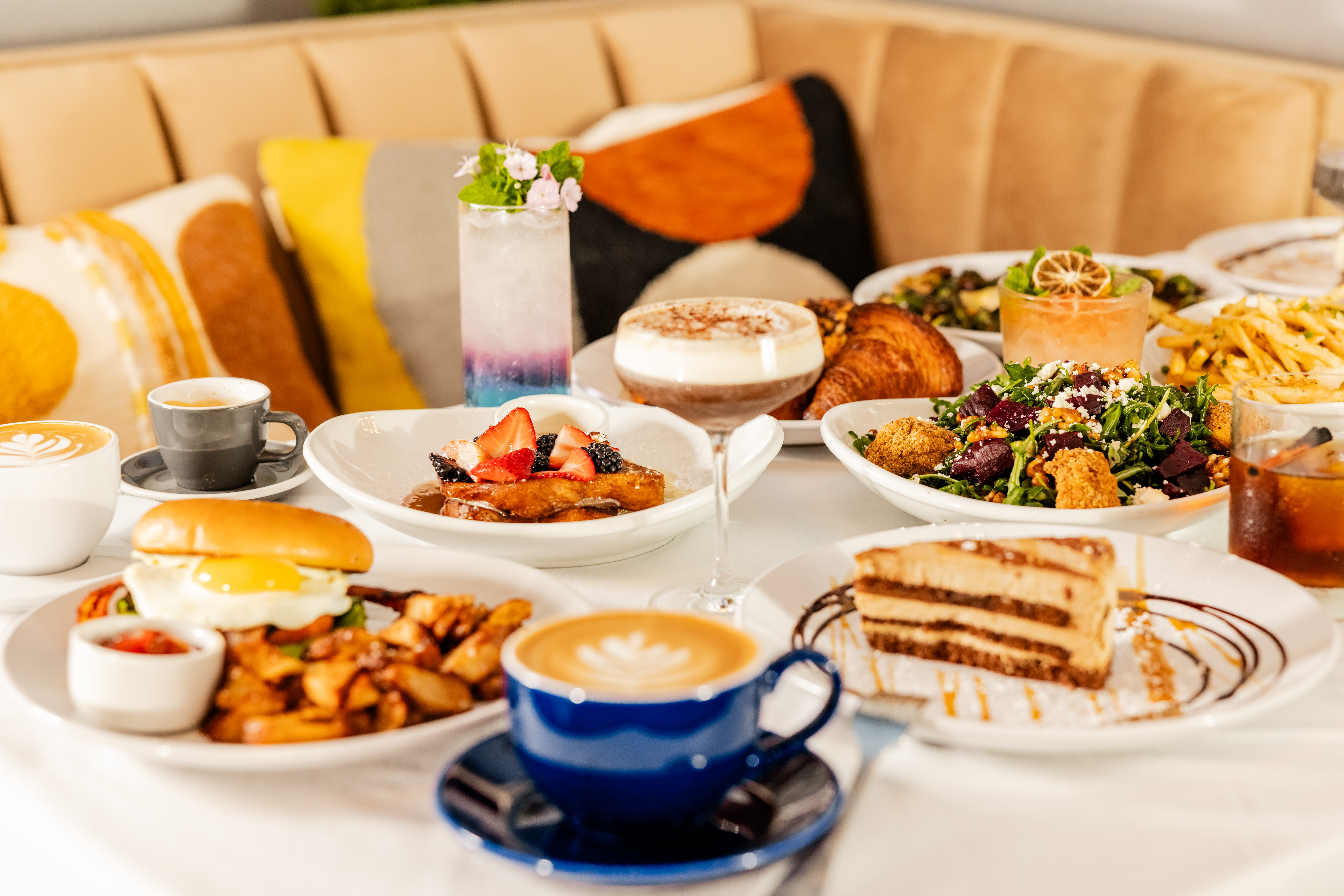 A table with various breakfast foods and drinks